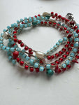 Collana mare lunga multifilo perline rosse blu perle naturali. Gioiello boho chic handmade. Bracciale avvolgente trendy accessorio estivo donna