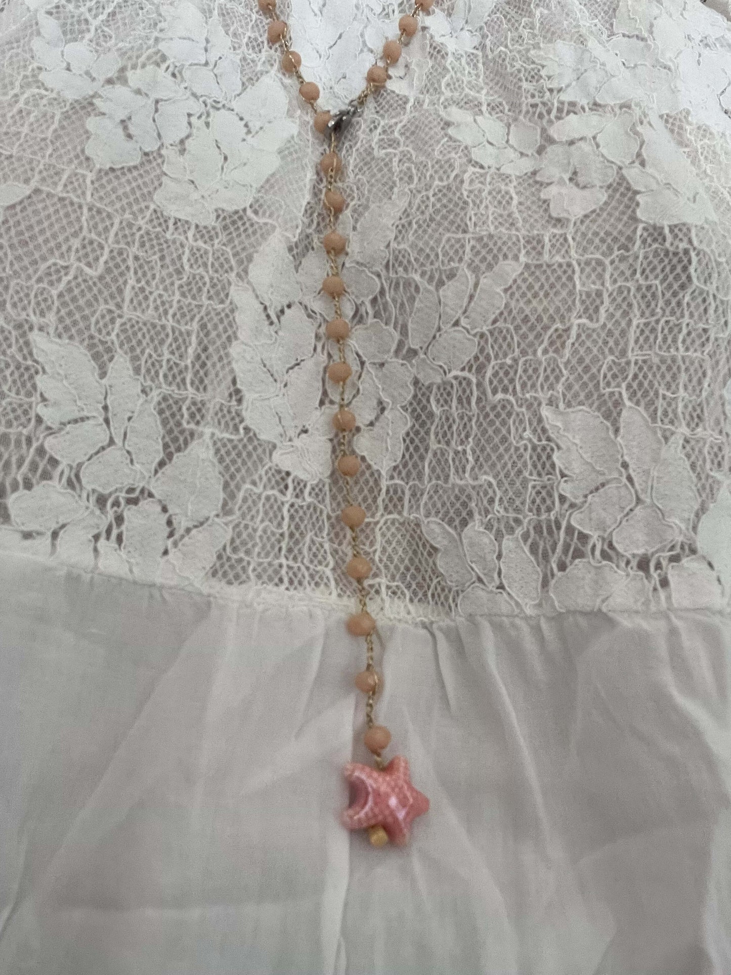 Collana boho crema con stella in ceramica e cristalli. Look naturale e romantico, anche come bracciale.