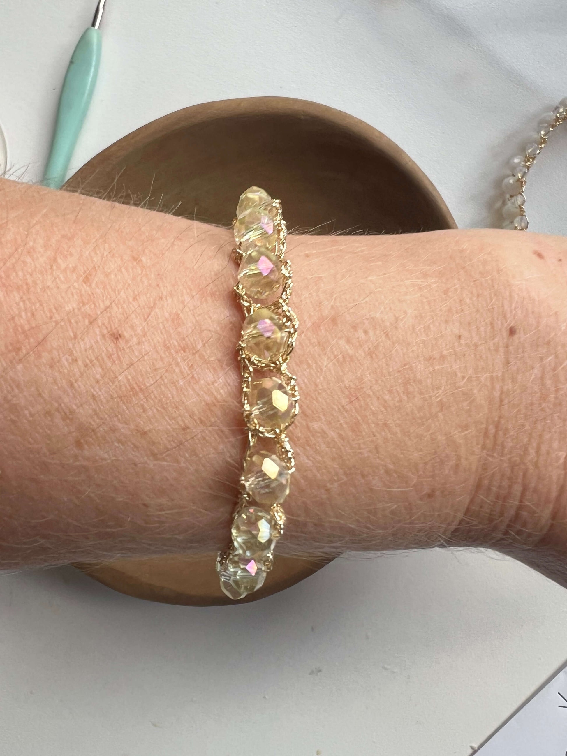 Adjustable handmade bracelet with crystals and gold thread, hand-crocheted. Perfect for boho and chic looks.