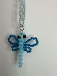 a tua metamorfosi merita un simbolo. Collana Libellula con perline giapponesi e ciondolo artigianale. Ricordati quanto sei luminosa. Shop ora