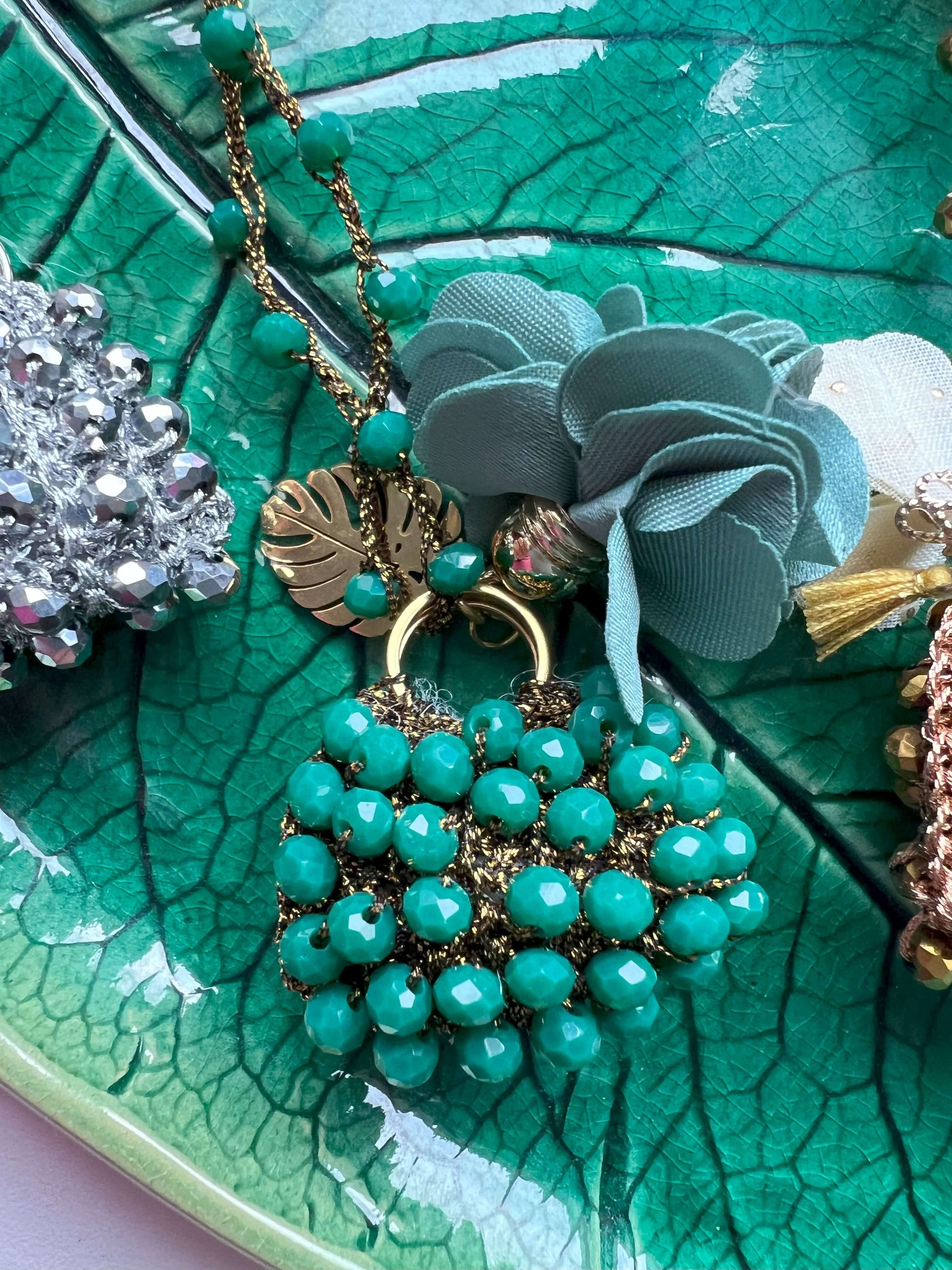 Handmade mini bag pendant necklace with burgundy crystals and floral charms