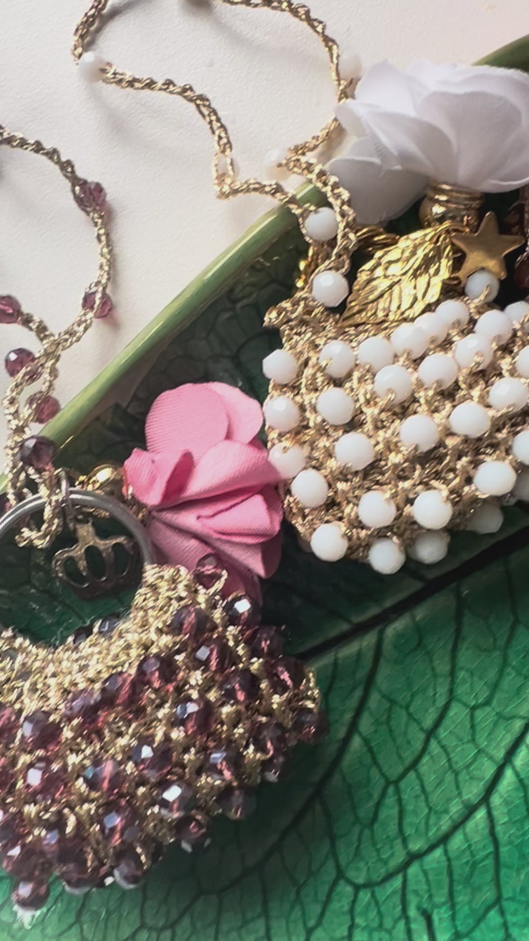 Handmade mini bag pendant necklaces in purple, white, and beige crystals with floral charms – perfect gifts for women