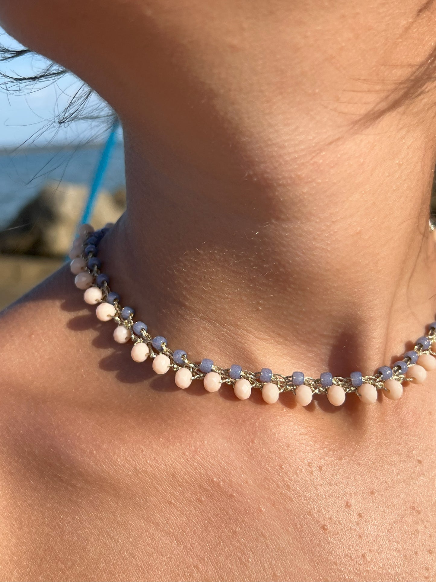 Woman wearing comfortable crystal choker boho minimalist style